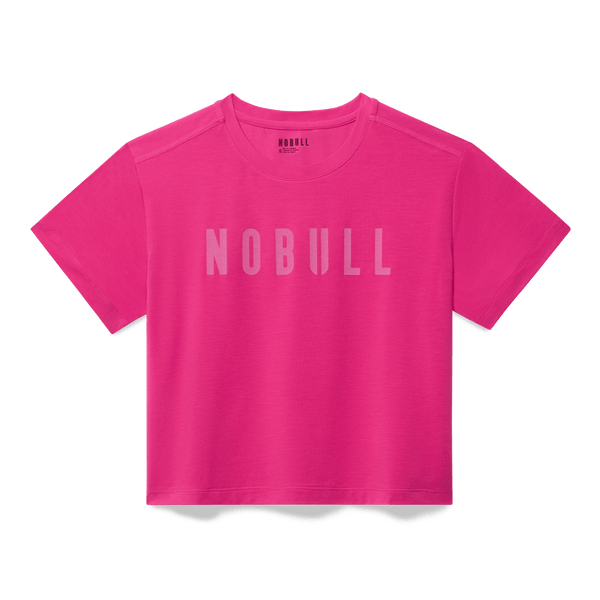 Women's Signal Pink NOBULL Boxy Tee Flat Lay Angle.