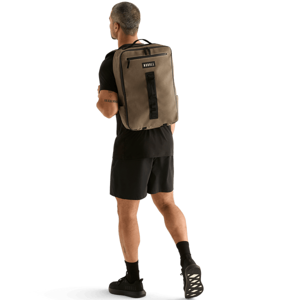 Man Wearing NOBULL Fallen Rock Waxed Backpack On Body Shot.