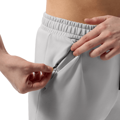 Women's Light Grey NOBULL Element Sweatpants Zipper Pocket Detail Angle.