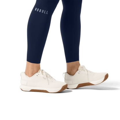 Women's Night Navy High-Rise Drive Tight 25" Ankle Detail Angle.