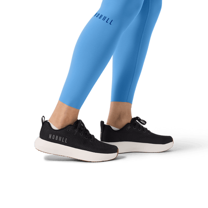 Women's Light Blue High-Rise Drive Tight 25" Lower Body Detail Angle.