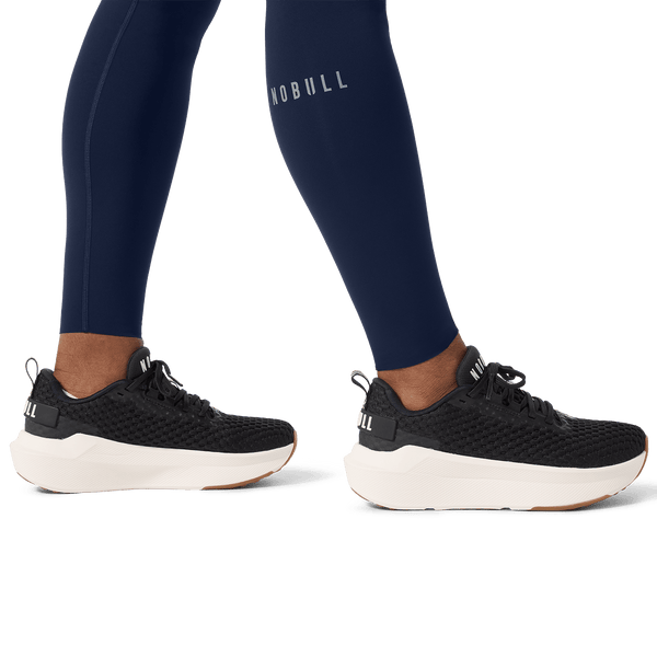 Women's Night Navy High-Rise Drive Tight 28" Ankle Detail Angle.