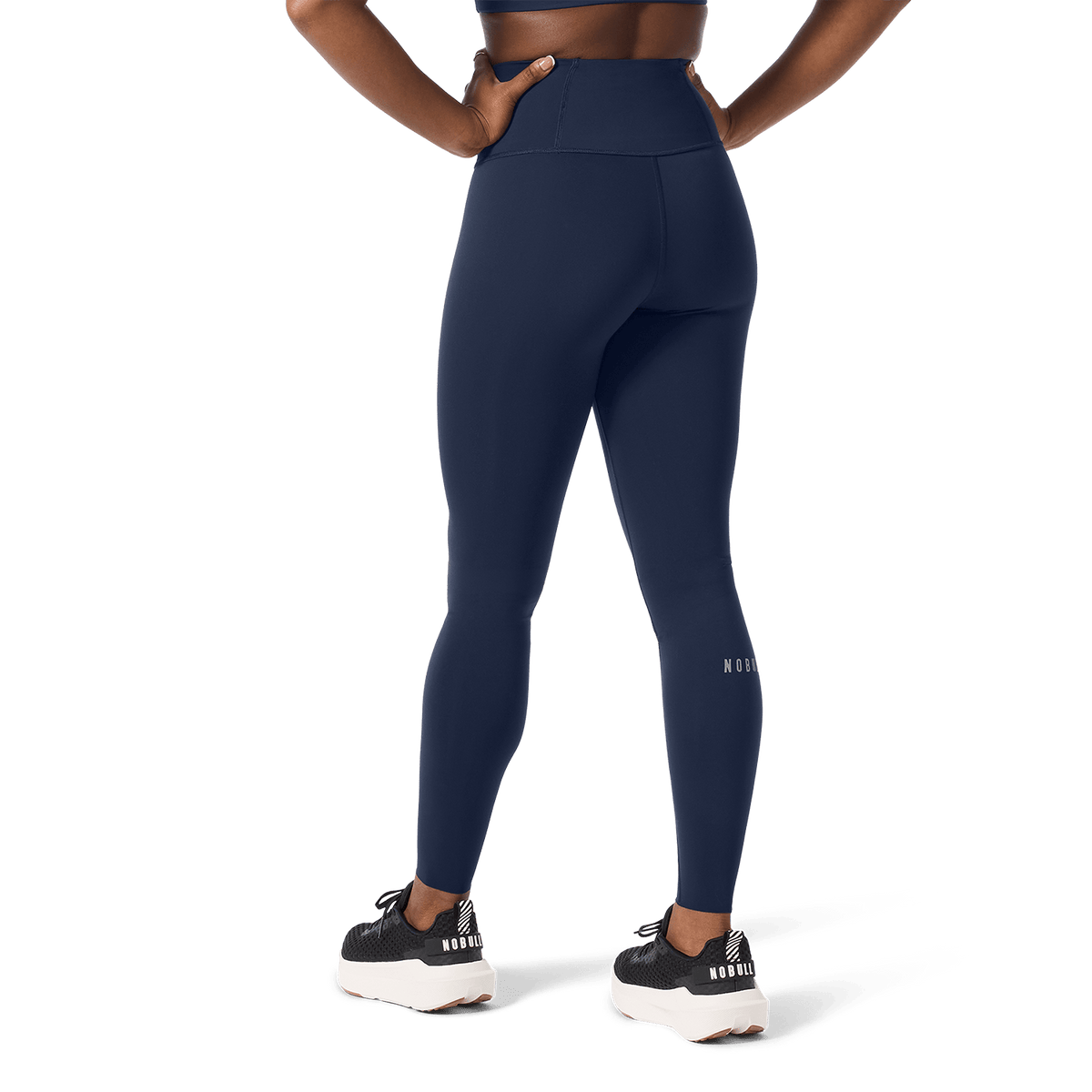 Women's Night Navy High-Rise Drive Tight 28" Back Lower Body Angle.