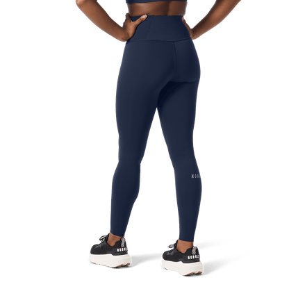 Women's Night Navy High-Rise Drive Tight 28" Back Lower Body Angle.