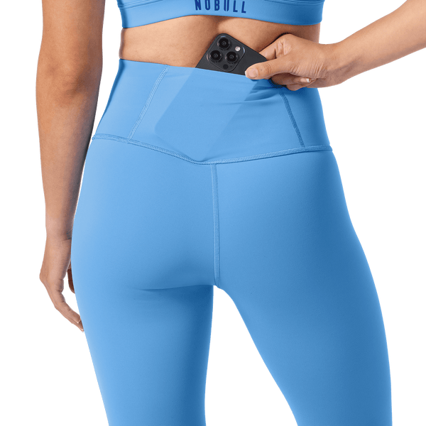 Women's Light Blue High-Rise Drive Tight 28" Back Pocket Detail Angle.