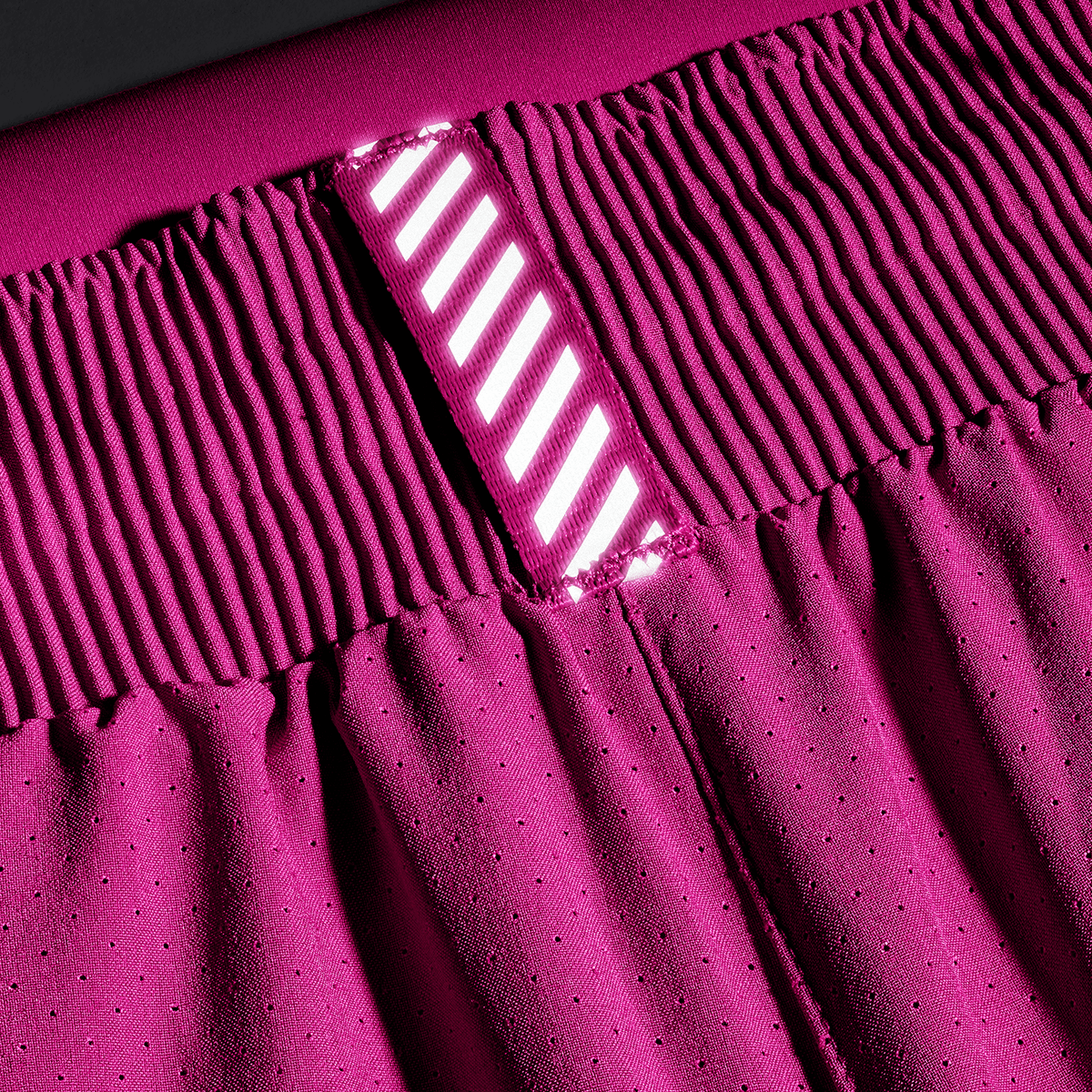 Women's Vivid Fuchsia Drive 2-in-1 Short 3" Reflective Tab Detail Angle.