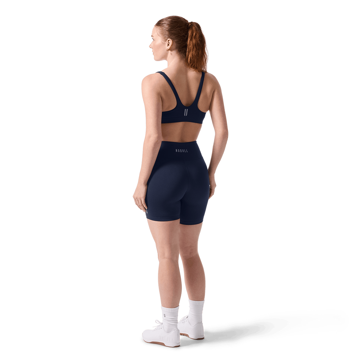 Women's Night Navy U High-Rise Matte Short 6" Back On Body Angle.