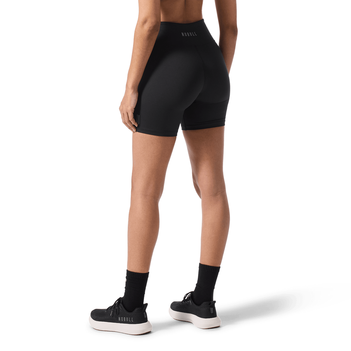 Women's Black U High-Rise Matte Short 6" Back Lower Body Angle.