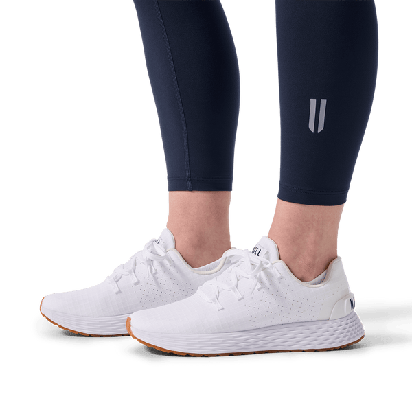 Women's Night Navy U High-Rise Matte Tight 25" U Logo Detail Angle.