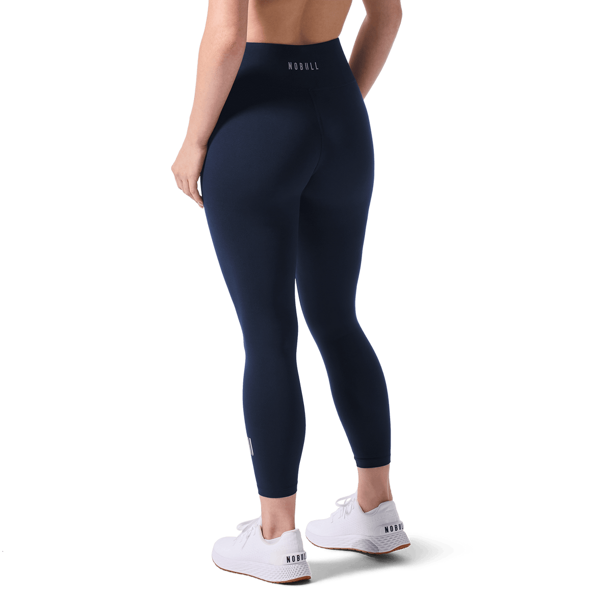 Women's Night Navy U High-Rise Matte Tight 25" Back Lower Body Angle.