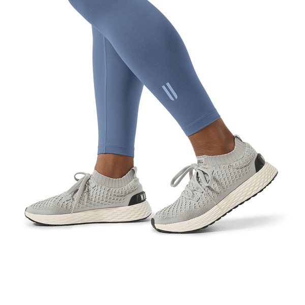 Women's Dusty Blue U High-Rise Matte Tight 25" Footwear Detail Angle.