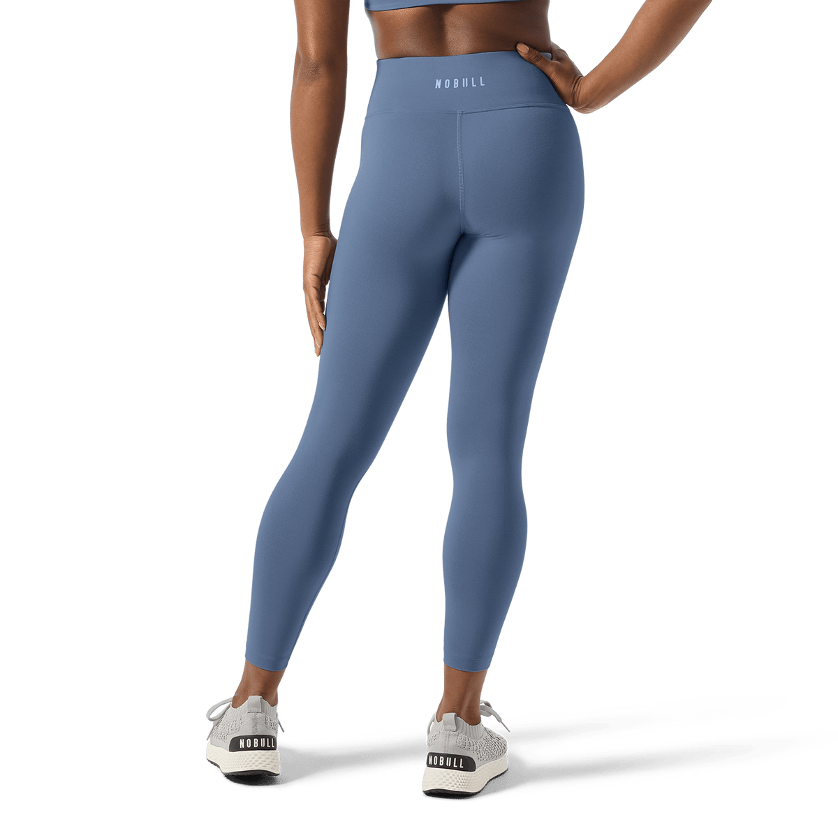 Women's Dusty Blue U High-Rise Matte Tight 25" Back Lower Body Angle.