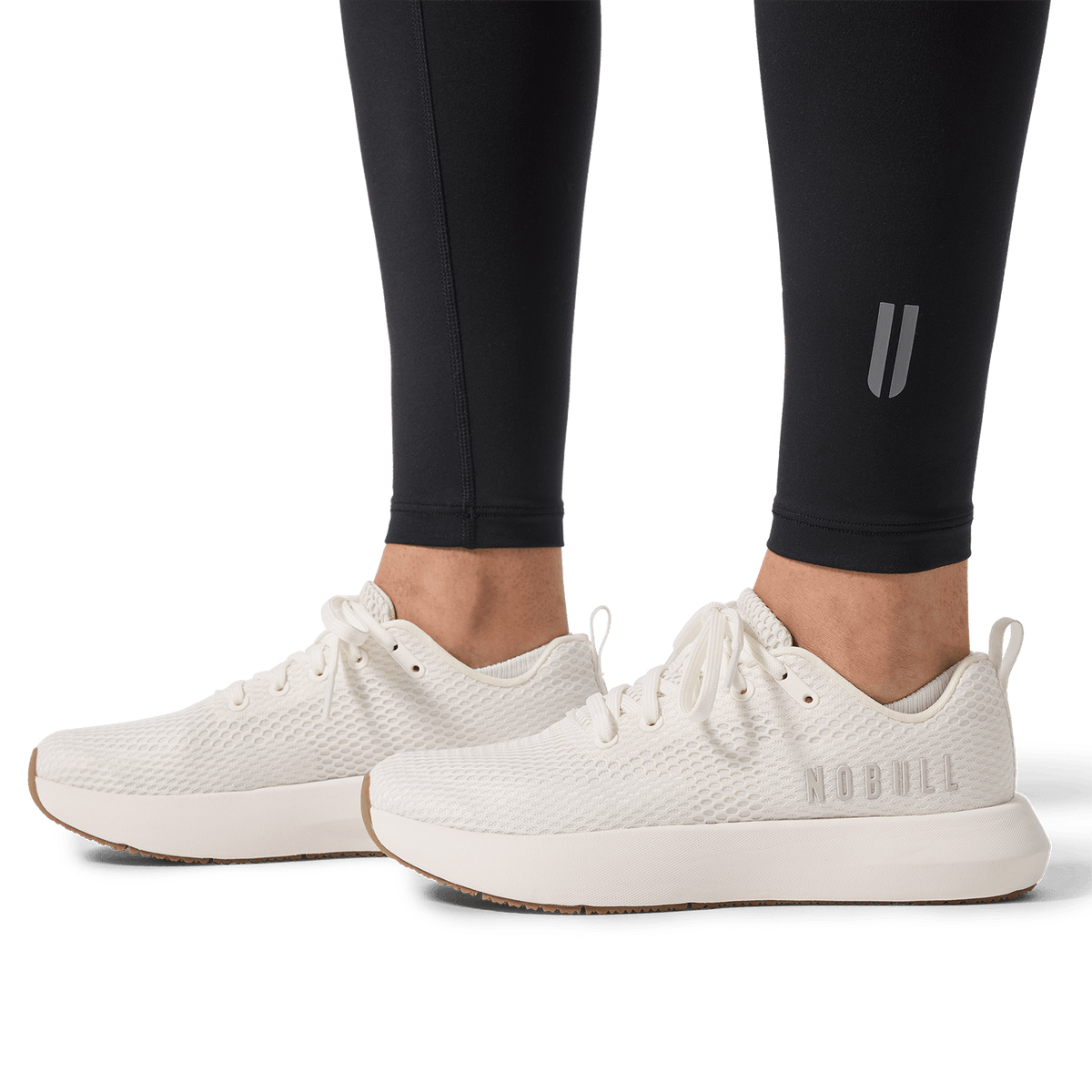 Women's Black U High-Rise Matte Tight 28" Detail Angle.