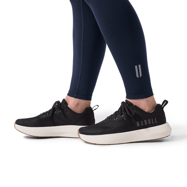 Women's Night Navy U High-Rise Matte Tight 28" Detail Angle.