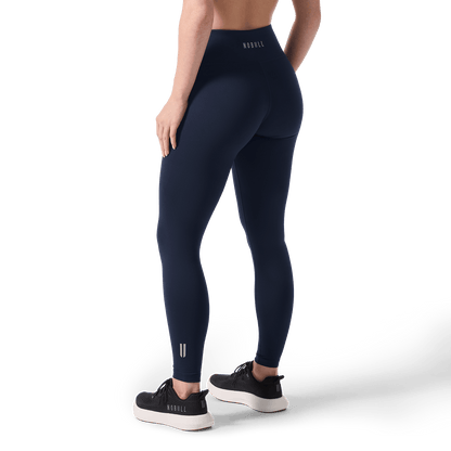 Women's Night Navy U High-Rise Matte Tight 28" Back Lower Body Angle.