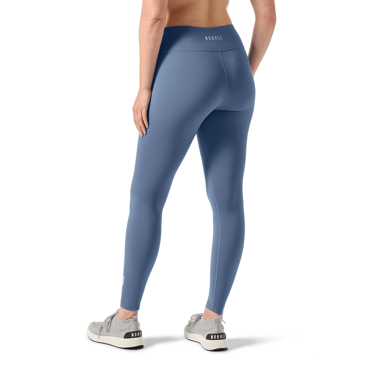Women's Dusty Blue U High-Rise Matte Tight 28" Back Lower Body Angle.