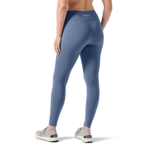Women's Dusty Blue U High-Rise Matte Tight 28" Back Lower Body Angle.